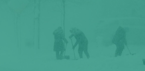 people shoveling snow with green overlay