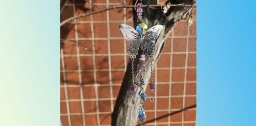 butterfly suncatcher in tree