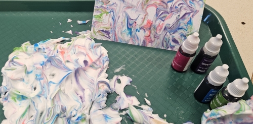 shaving cream, notecard, and food coloring