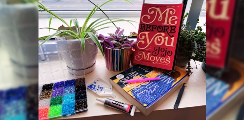 bedazzled books with rhinestones nearby