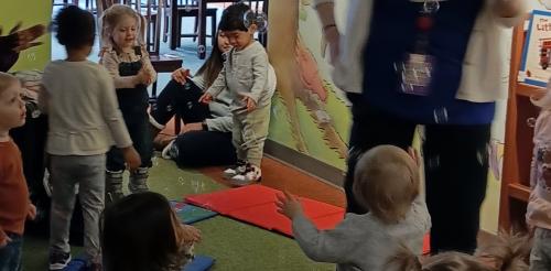 Children playing with bubbles in the library