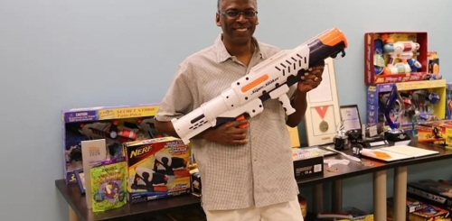 photo of man holding super soaker water gun