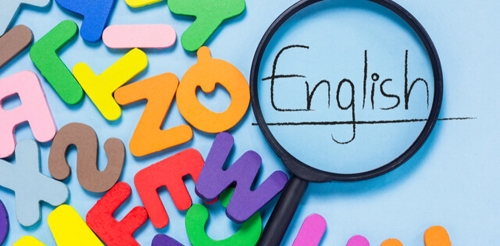 foam letters, magnifying glass, and the word "English"