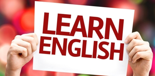 hands holding paper with words "Learn English"