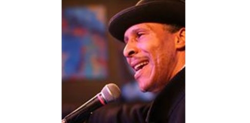 man in hat with microphone