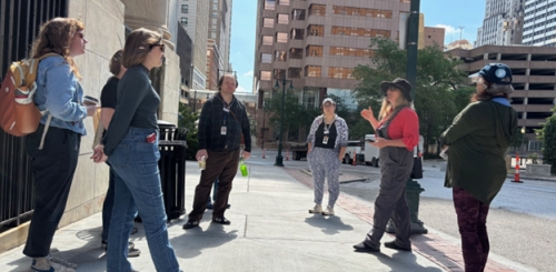 A group of Library staffers gathers for an Urban Hike outside the Central Library.