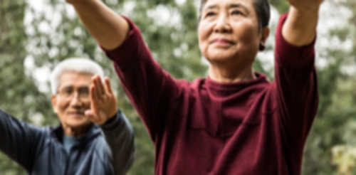 man and woman in tai chi pose