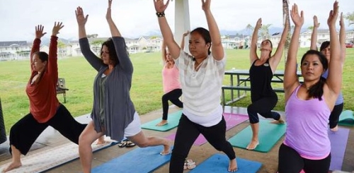 seven women in yoga poses