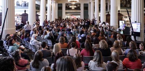Crowd seated in a large hall